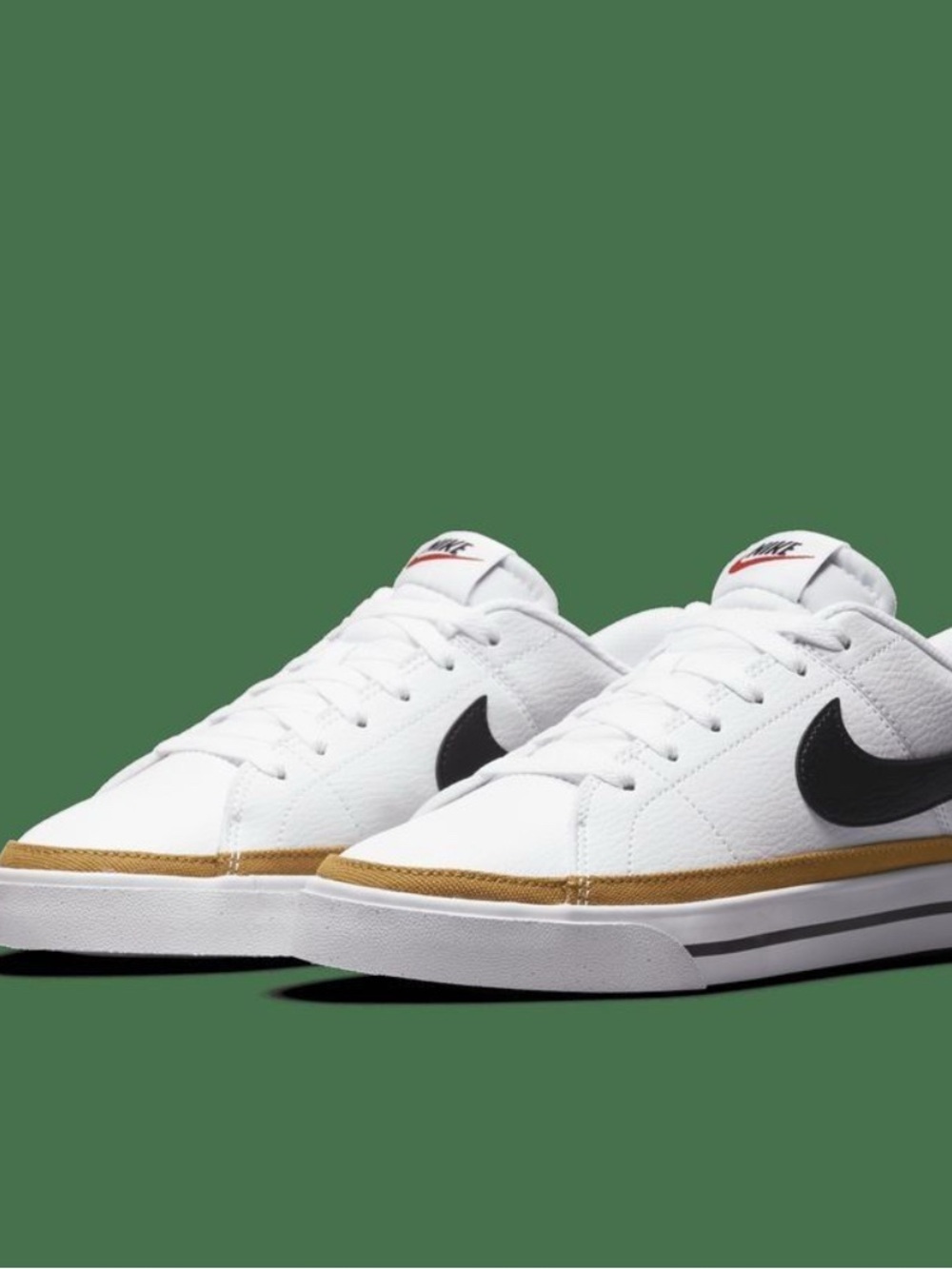 Nike White Sneakers with Black Swoosh and Gold Accent